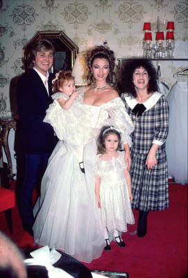 LOS ANGELES, CA - March 3, 1984: Jane Seymour the English actress, who at the time was starring in Dr. Quinn, Medicine Woman, poses with her children and David and Elizabeth Emanuel, in a dress designed by David and Elizabeth Emanuel, Welsh fashion designers who are best known for having designed (along with his then wife Elizabeth Emanuel) the wedding dress worn by Diana, Princess of Wales, at her marriage in 1981. March 3, 1984 , Los Angeles, California Jane Seymour with her children and the Emanuel's .
